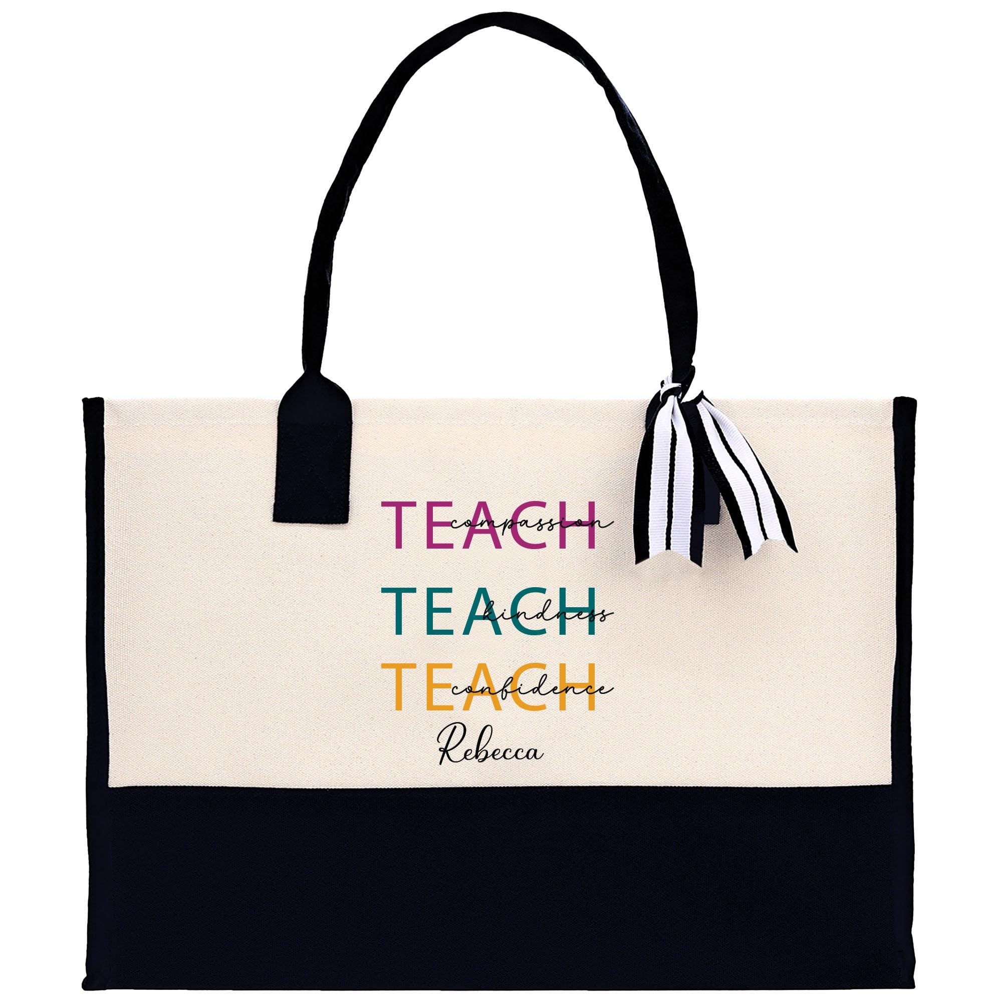 a black and white tote bag with a tassel