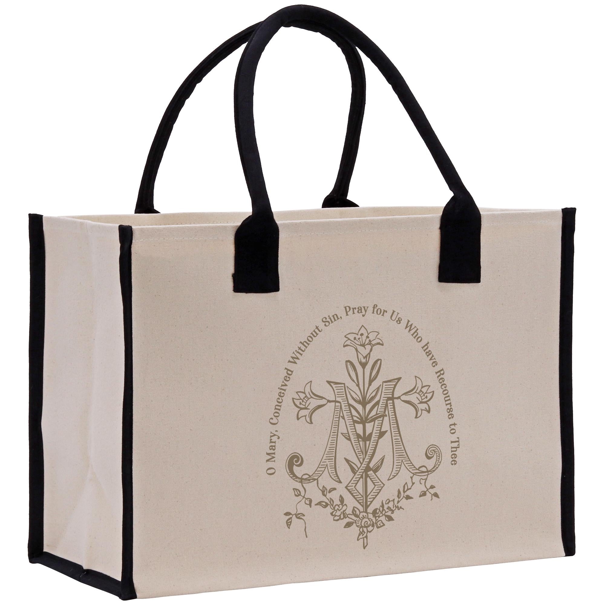 A beige canvas tote bag with a black handle and trim, featuring a decorative monogram and text.