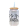 a white mason jar with a straw in it