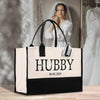 a black and white bag with a bride in the background