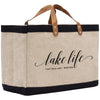 a large jute bag with a leather handle