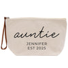 A beige canvas tote bag with the text "auntie" and "JENIFER EST 2025" printed on it.