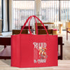a red bag sitting on top of a wooden table