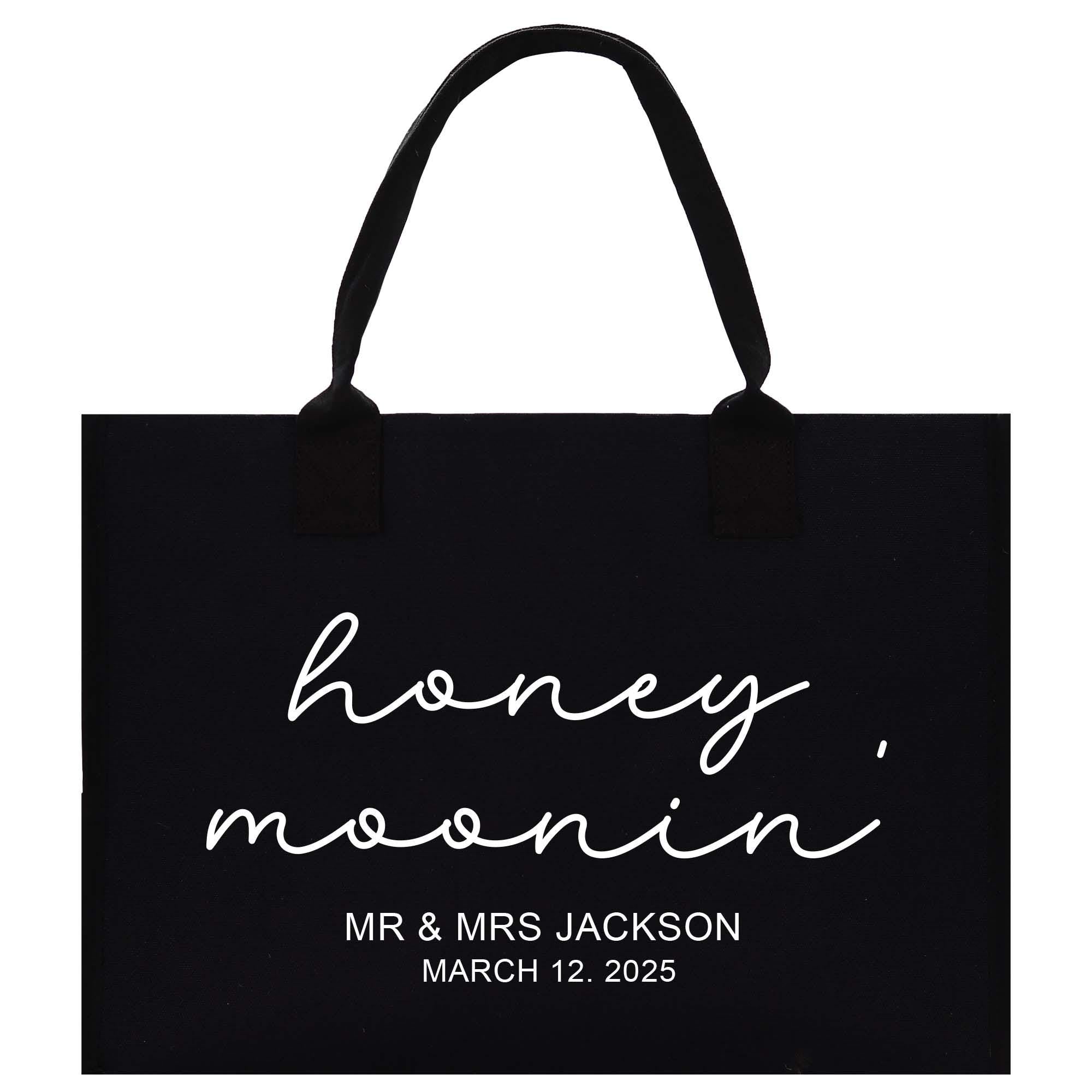 a black shopping bag with the words honey moon on it