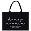 a black shopping bag with the words honey moon on it