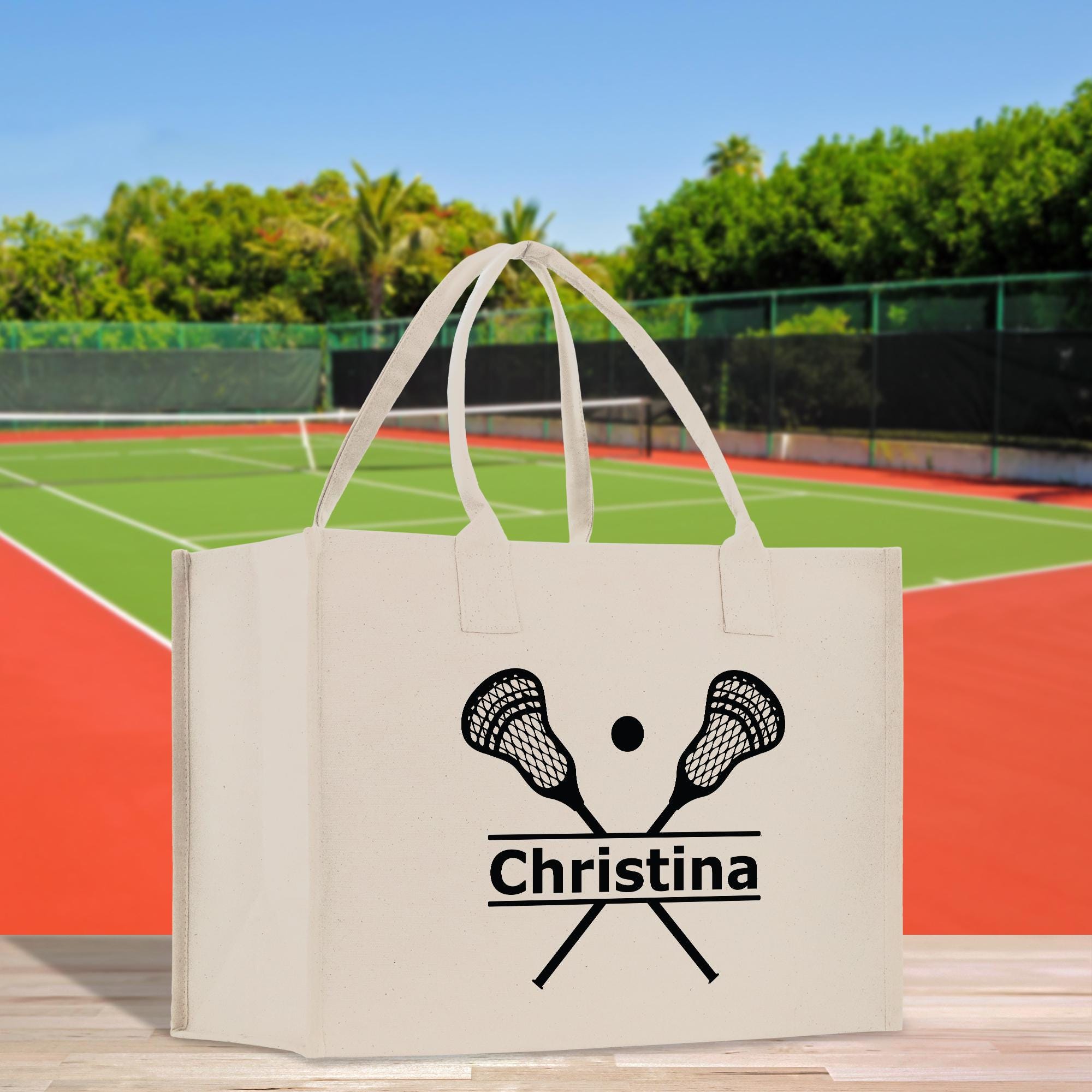 a bag with a tennis racket and ball on it