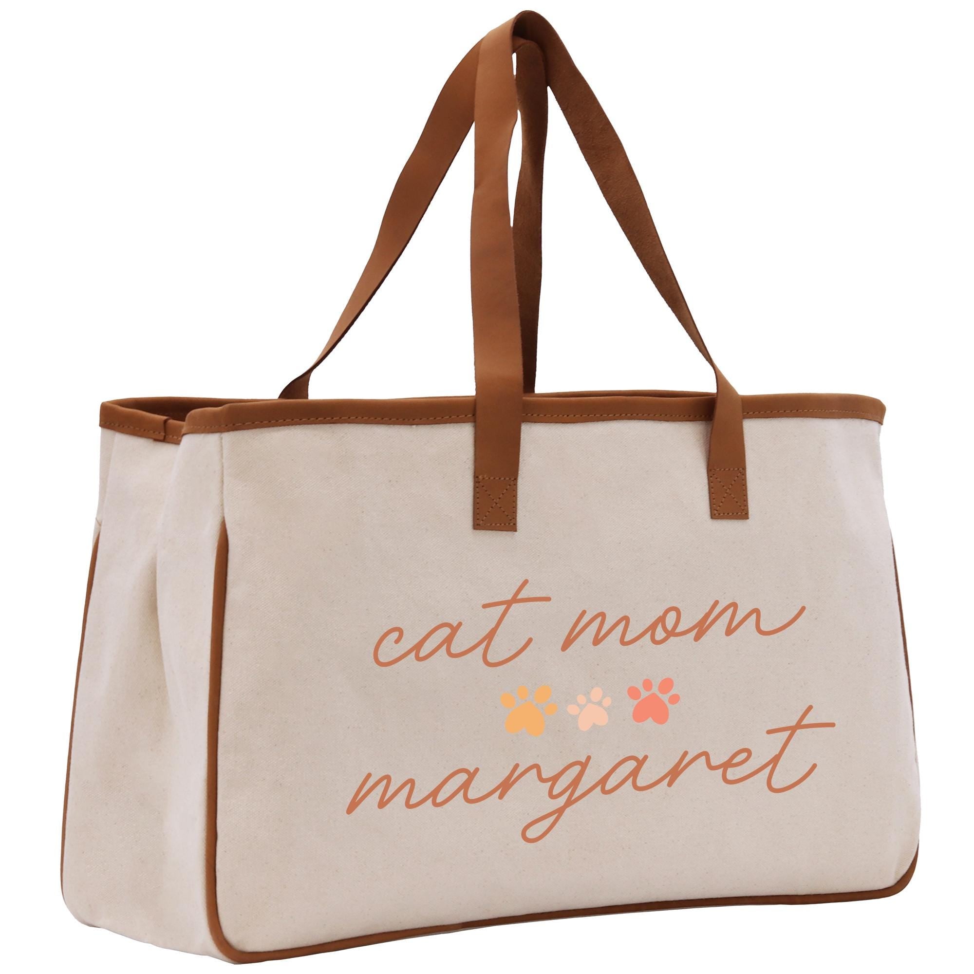 a canvas bag with a cat mom message on it