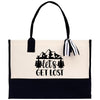 A black and white tote bag with a printed design and text on it.
