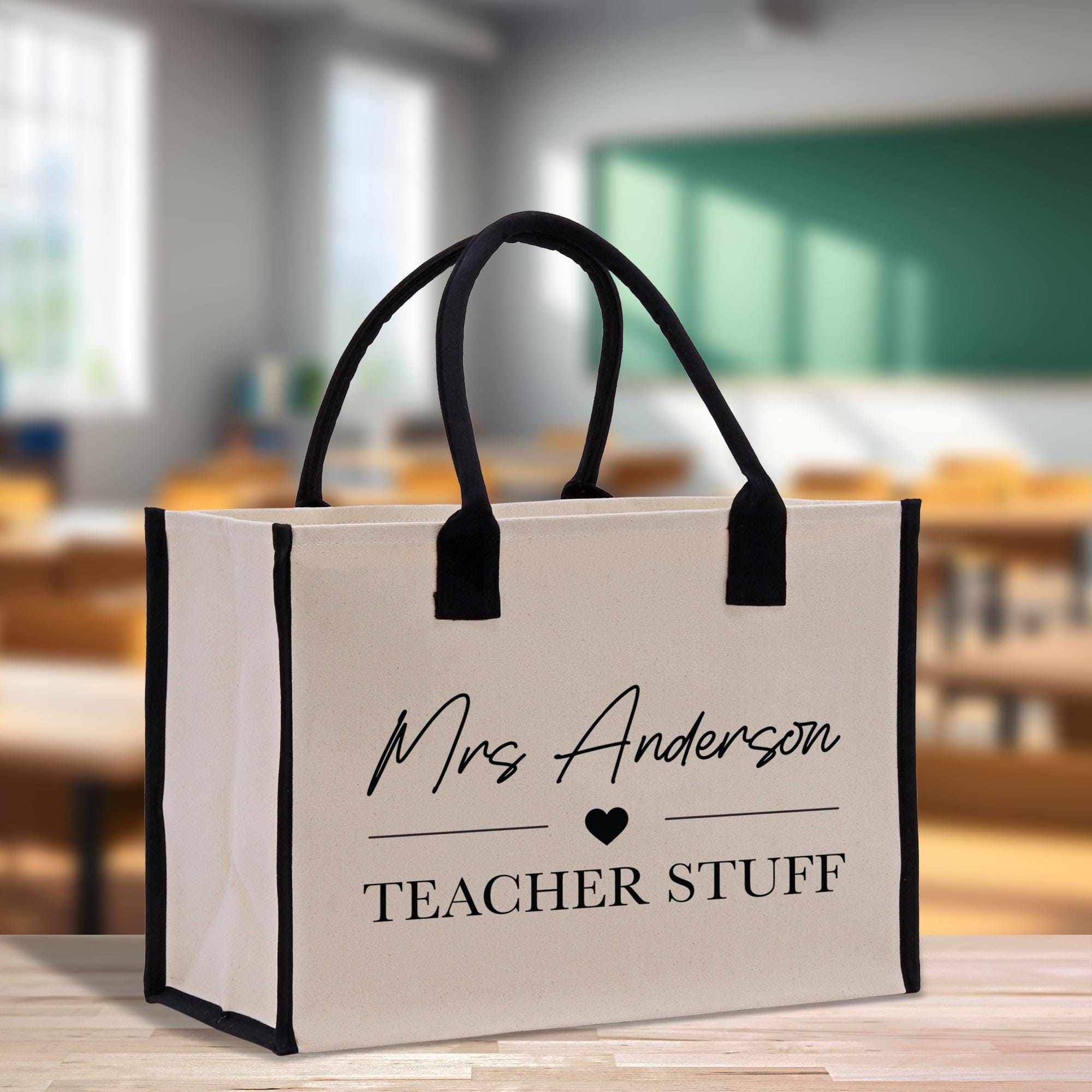 a teacher&#39;s bag sitting on a table in a classroom