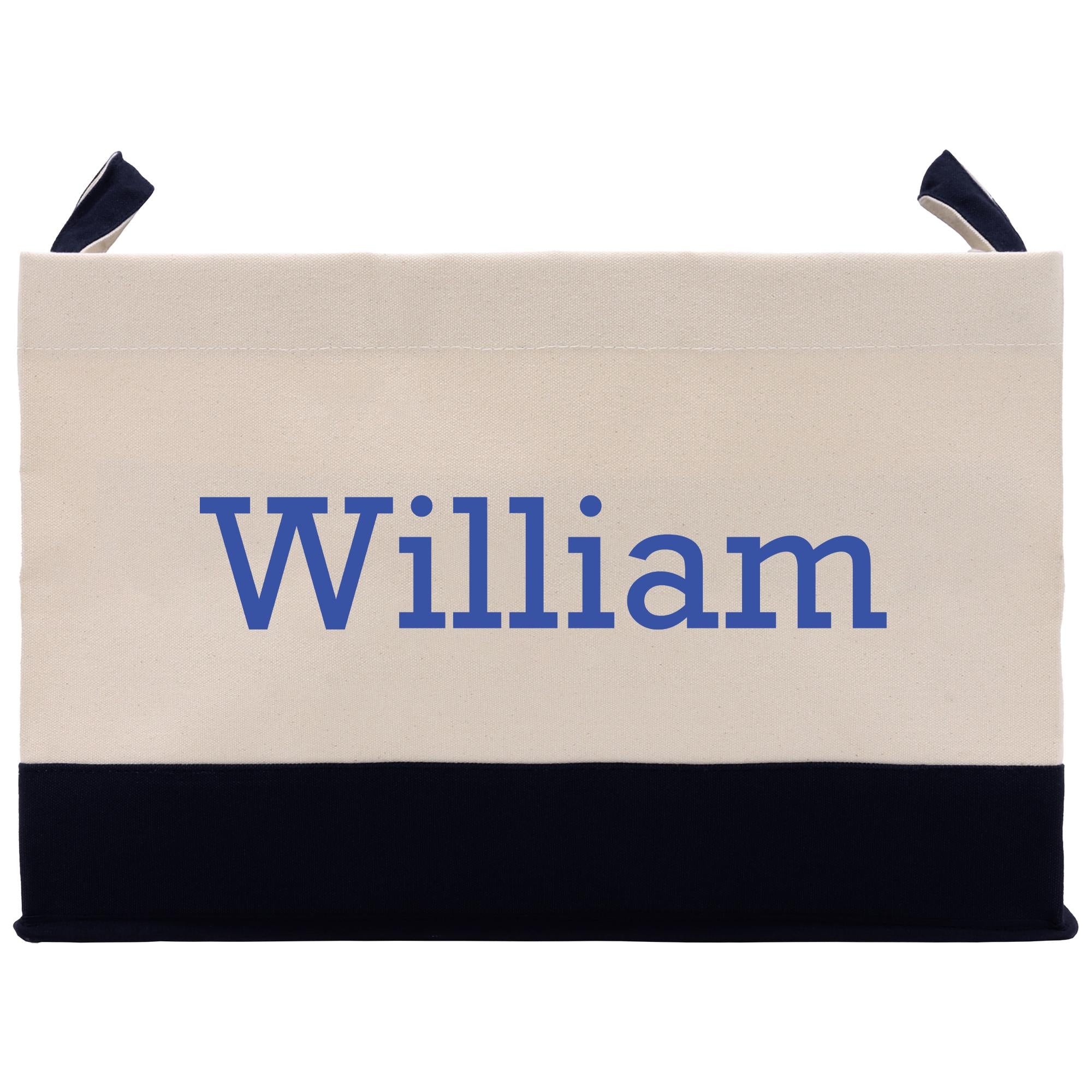 A beige canvas tote bag with the name &quot;William&quot; printed in blue on it.