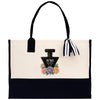 a black and white purse with a bottle of perfume