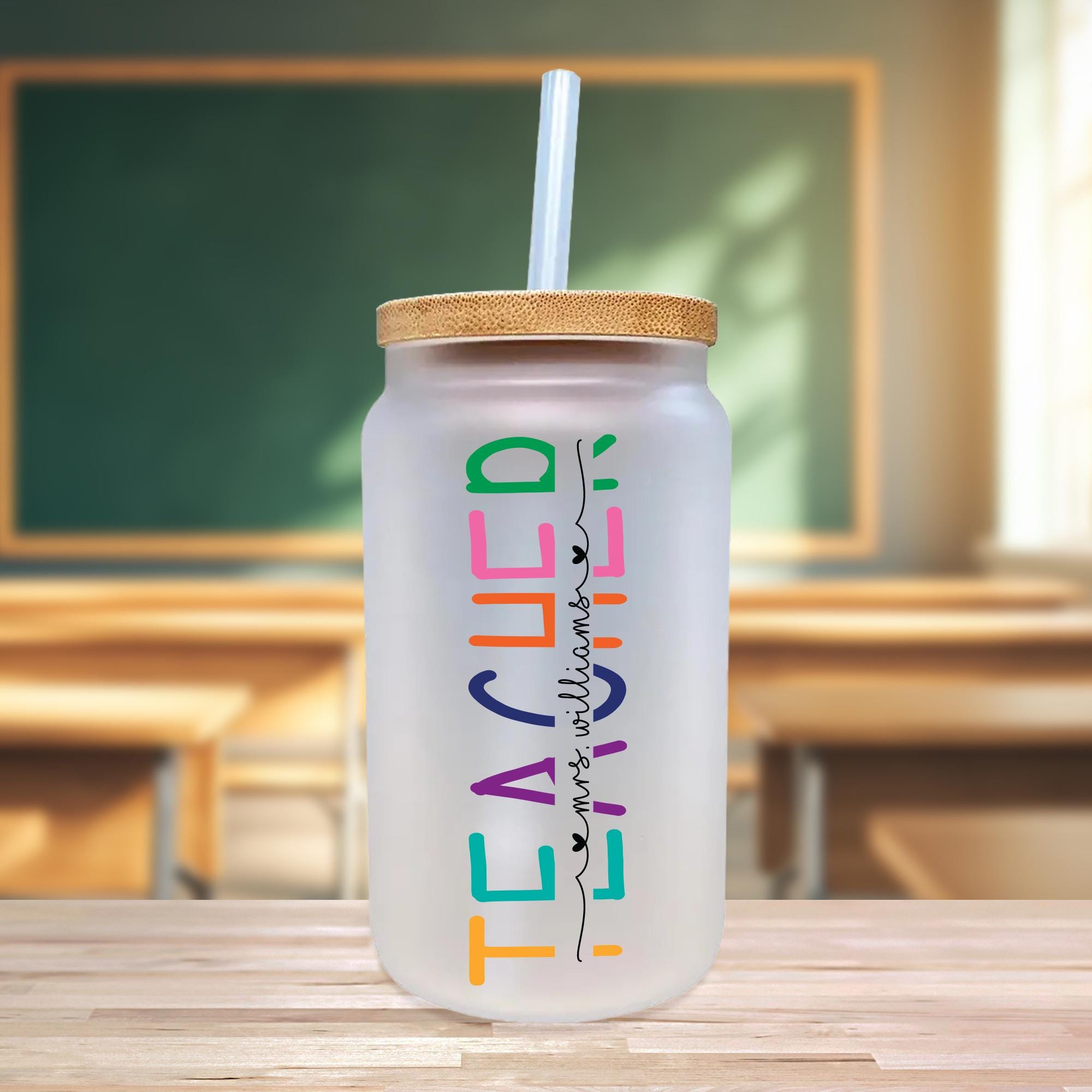 a plastic cup with a straw in it on a table