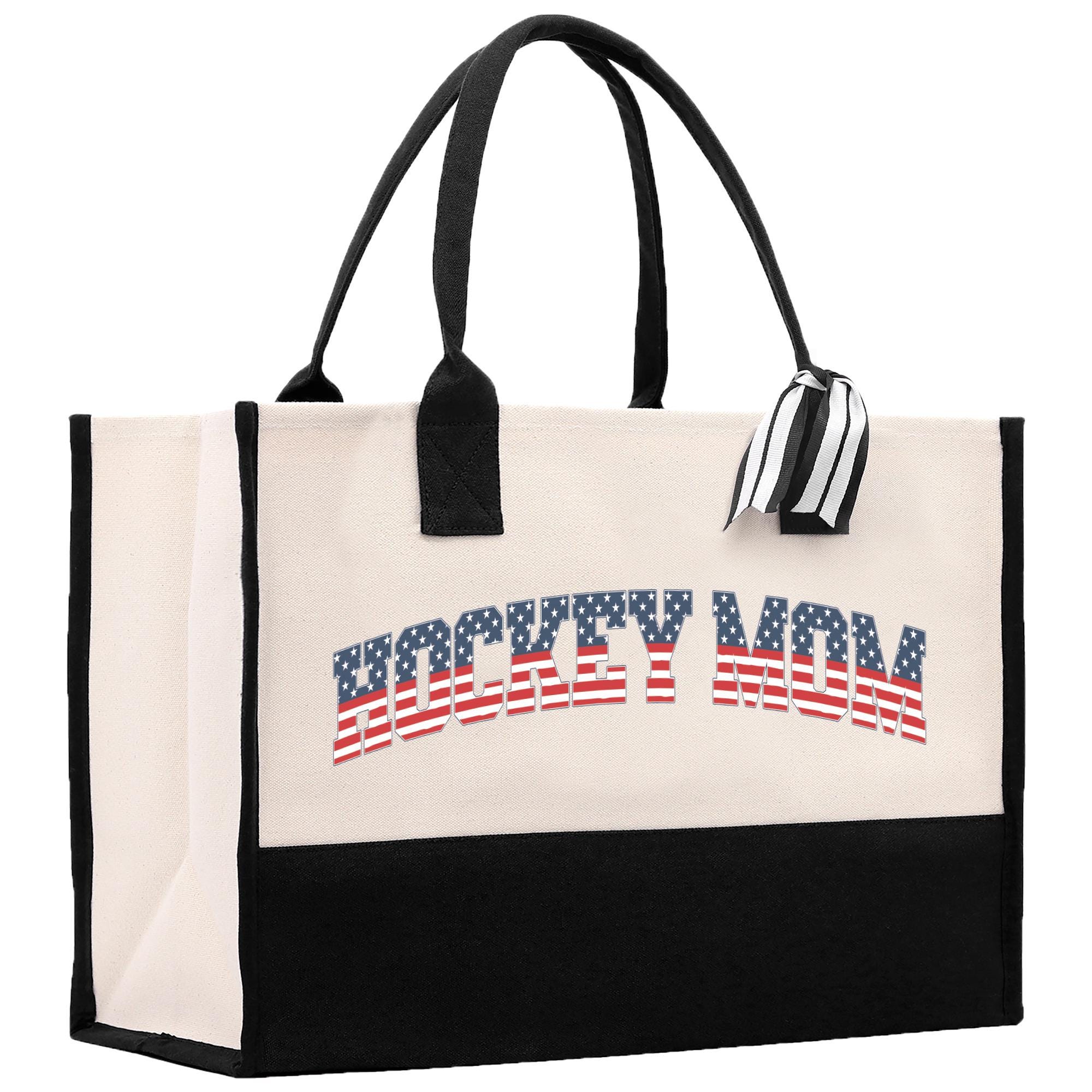 a white and black shopping bag with a red, white, and blue logo