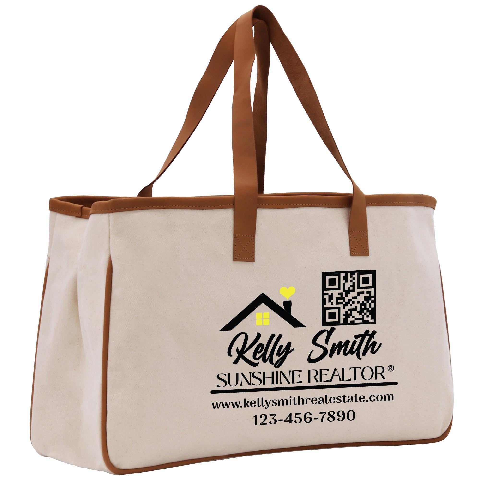 a canvas tote bag with a brown leather handle