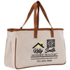 a canvas tote bag with a brown leather handle