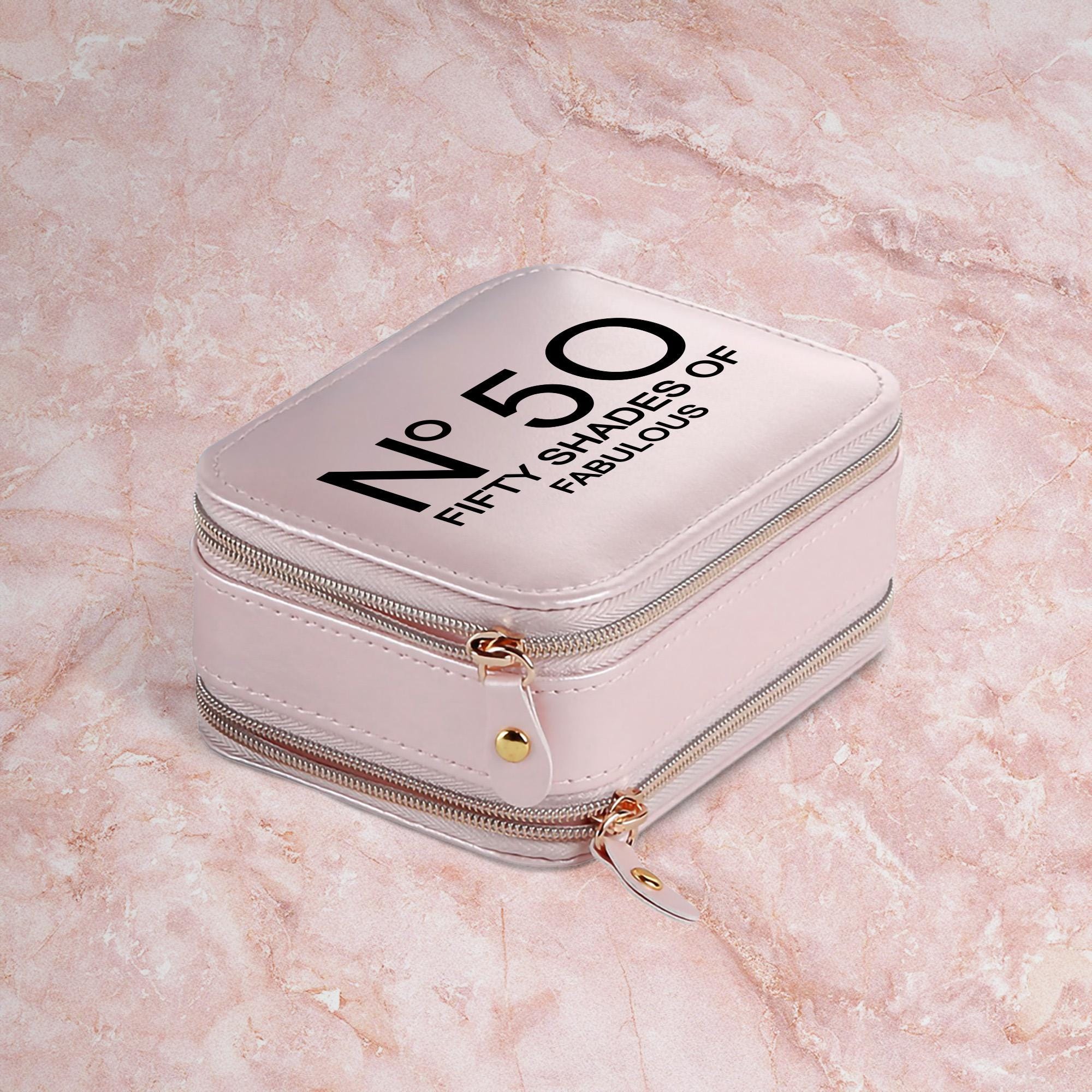 a white suitcase sitting on top of a marble floor