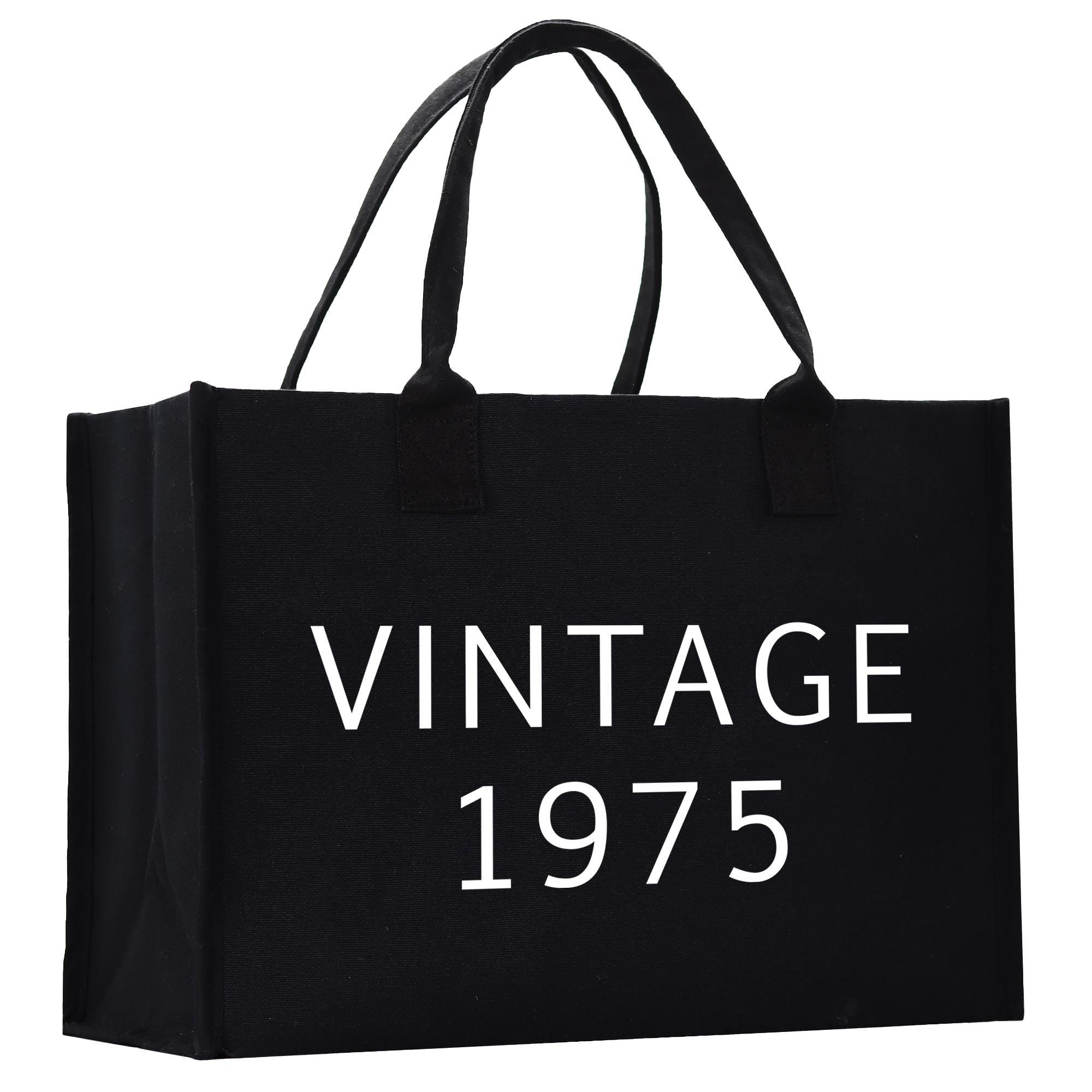 a black shopping bag with the words vintage written on it