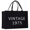 a black shopping bag with the words vintage written on it
