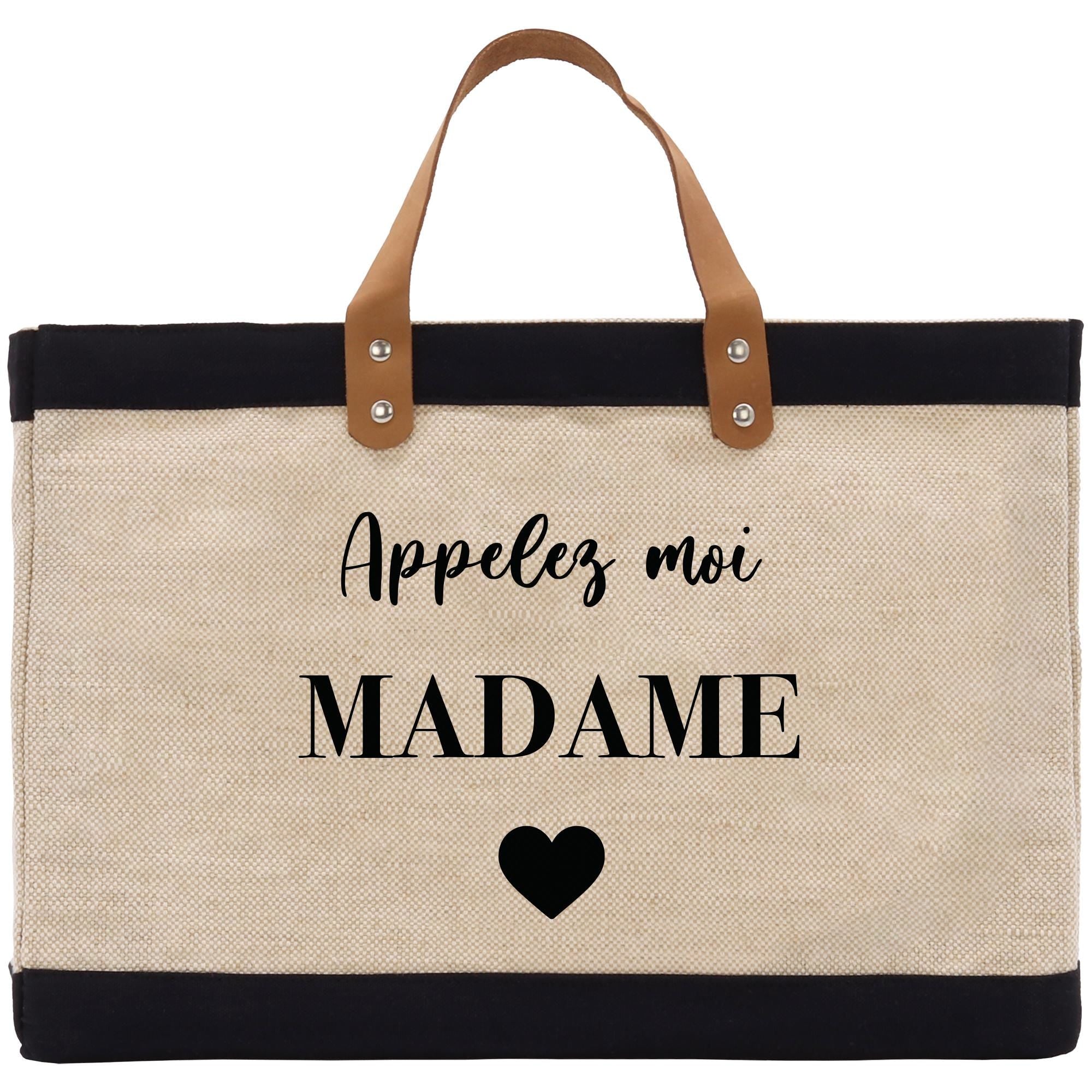 a black and white bag with a heart on it