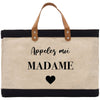a black and white bag with a heart on it