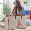 a woman holding a bag with a picture of a cartoon character on it