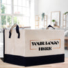 a white and black shopping bag sitting on top of a wooden table