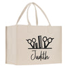 a white bag with scissors and a name on it