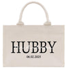 a white shopping bag with the word hubby printed on it