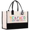 a black and white bag with a teacher on it