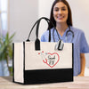 a woman in a blue shirt is holding a black and white bag