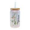 a glass jar with a straw in it