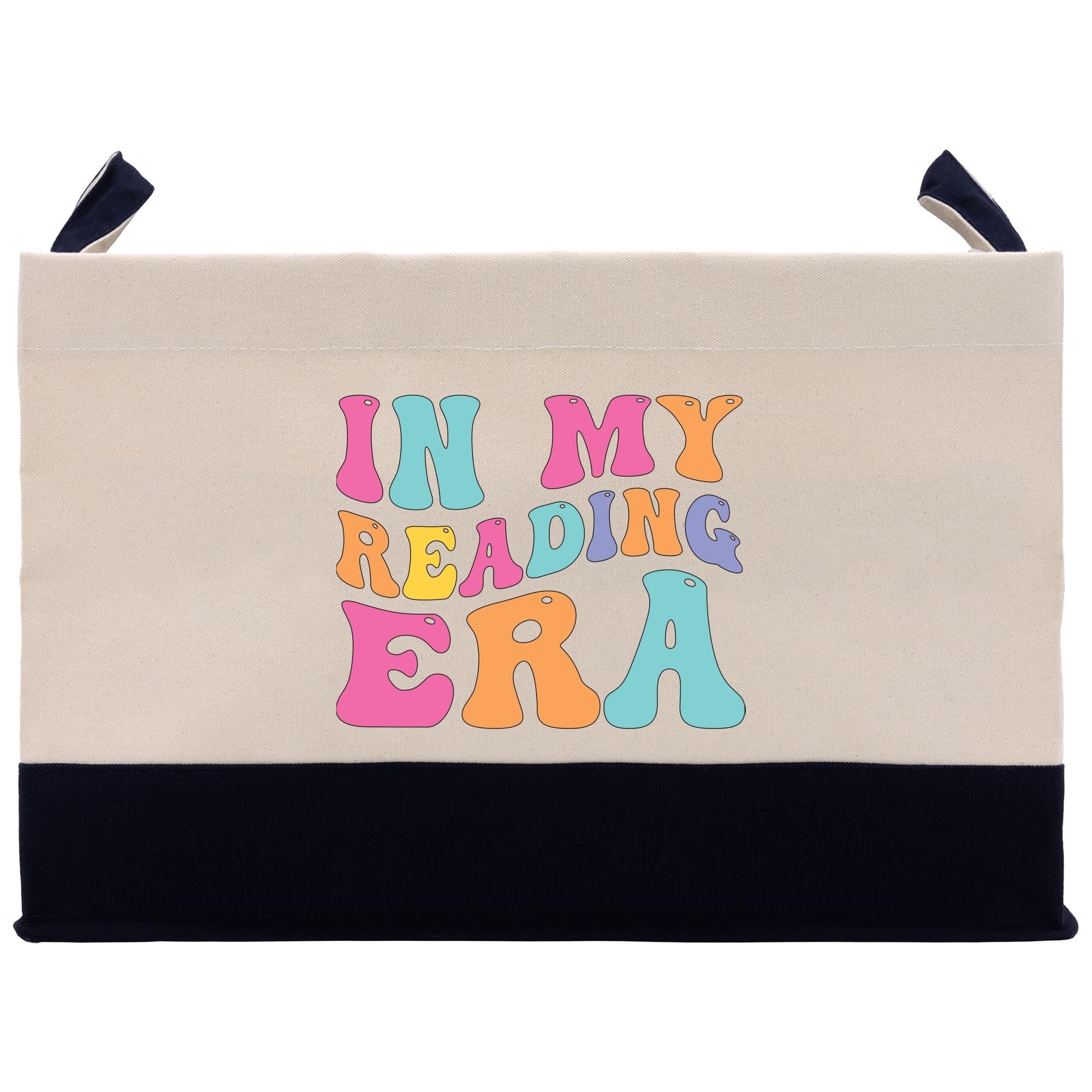 a canvas bag with the words i&#39;m my reading era printed on it