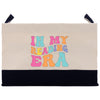 a canvas bag with the words i'm my reading era printed on it