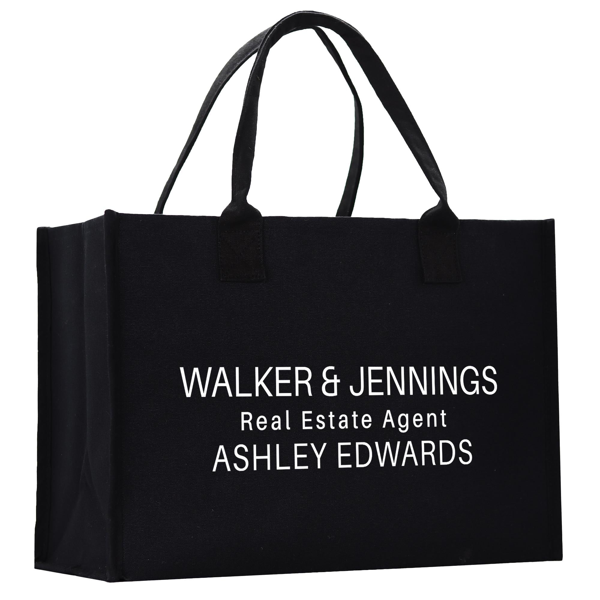 A black tote bag with white text printed on it.