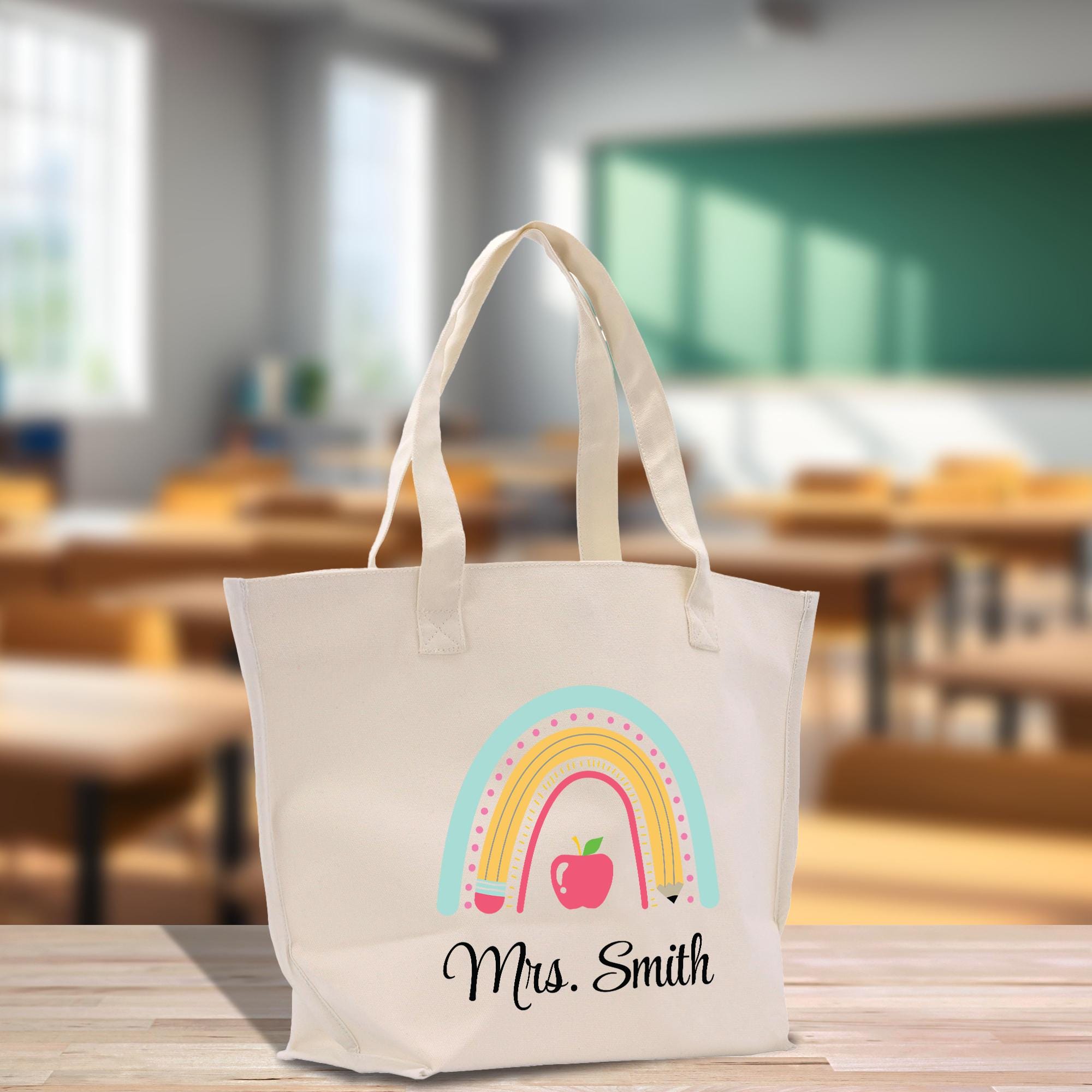 a white bag with a rainbow and apple on it