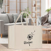 a canvas bag with a dandelion drawn on it