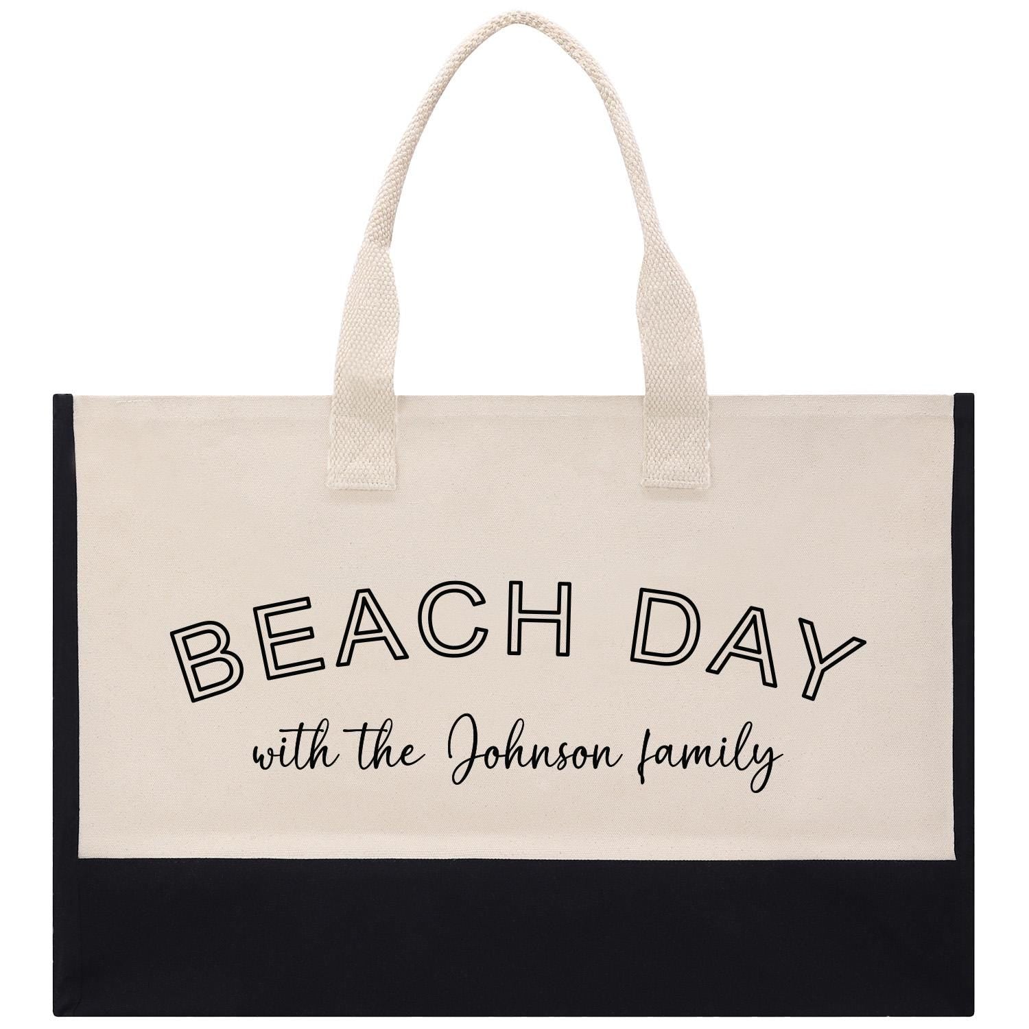 a black and white beach bag with the words beach day with the johnson family