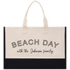 a black and white beach bag with the words beach day with the johnson family