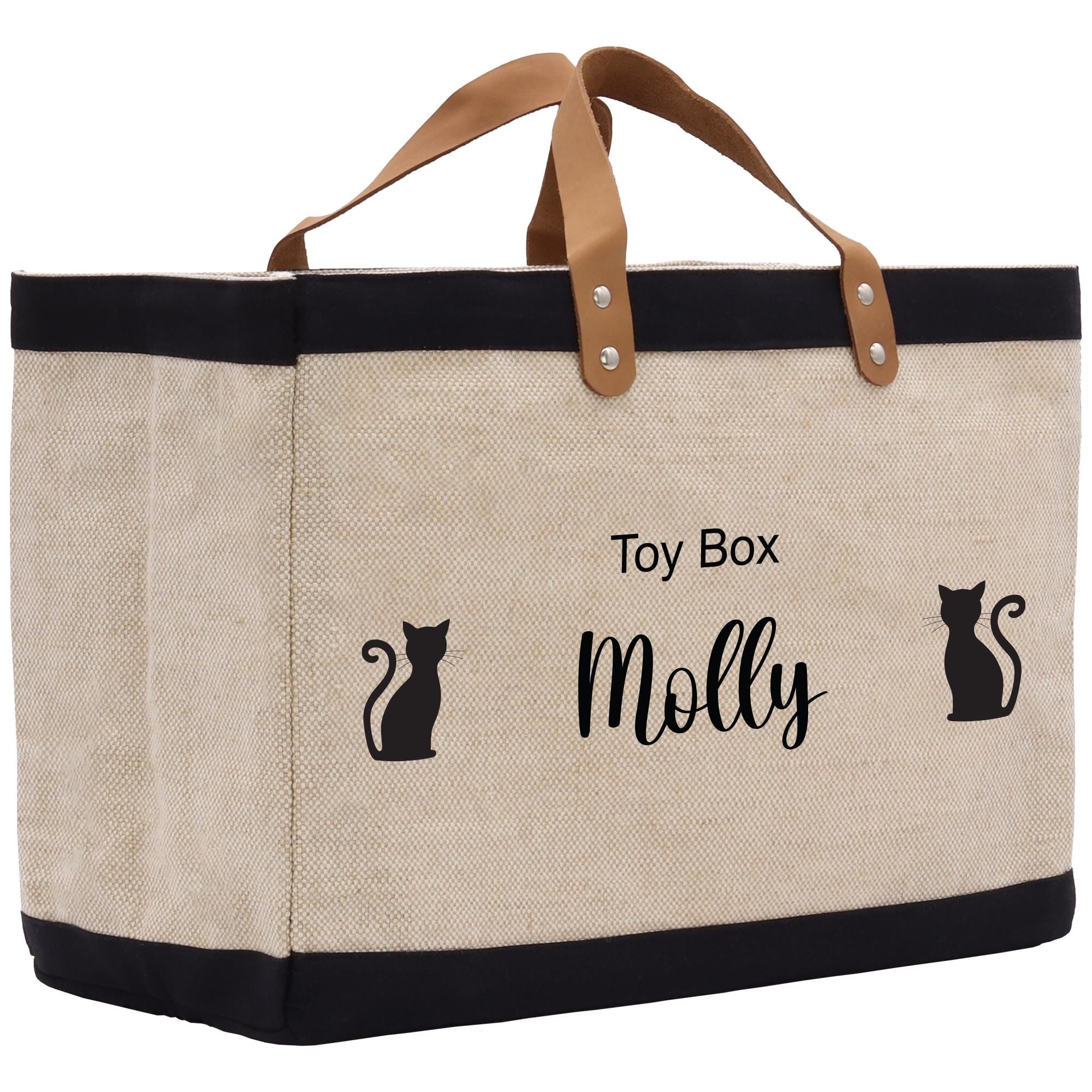 a canvas tote bag with a cat design