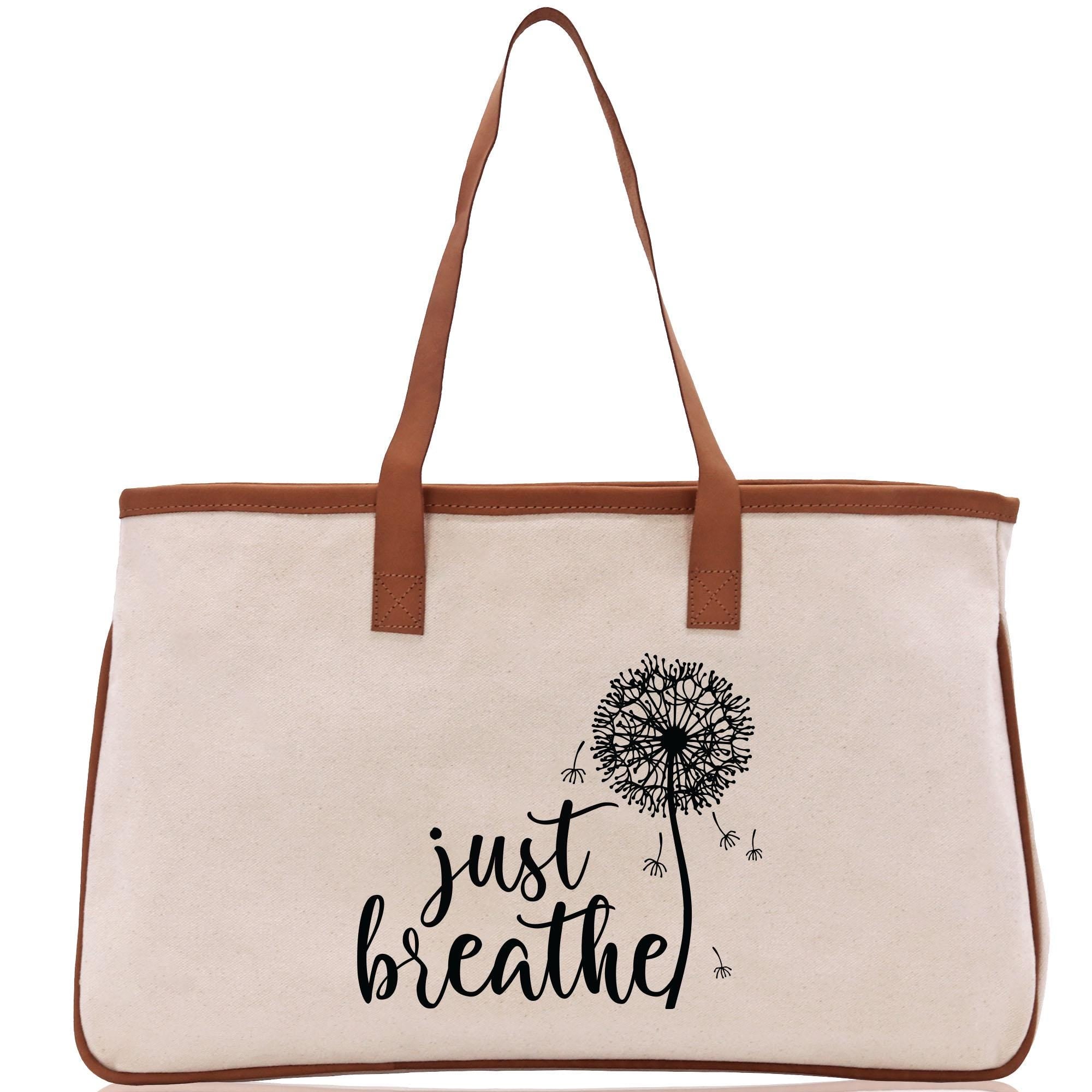 a canvas bag with a dandelion on it