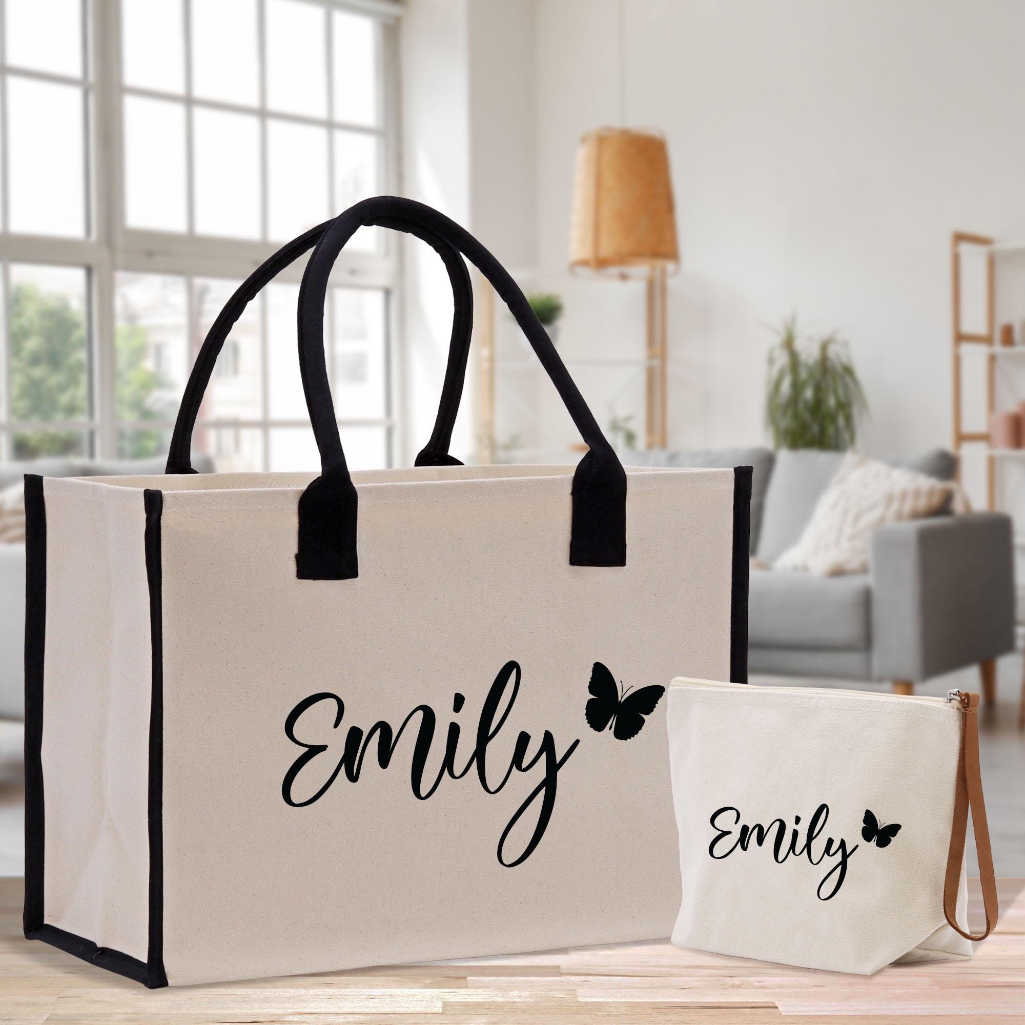a white bag and a black and white bag on a table