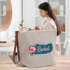 a woman standing in front of a table with a bag on it