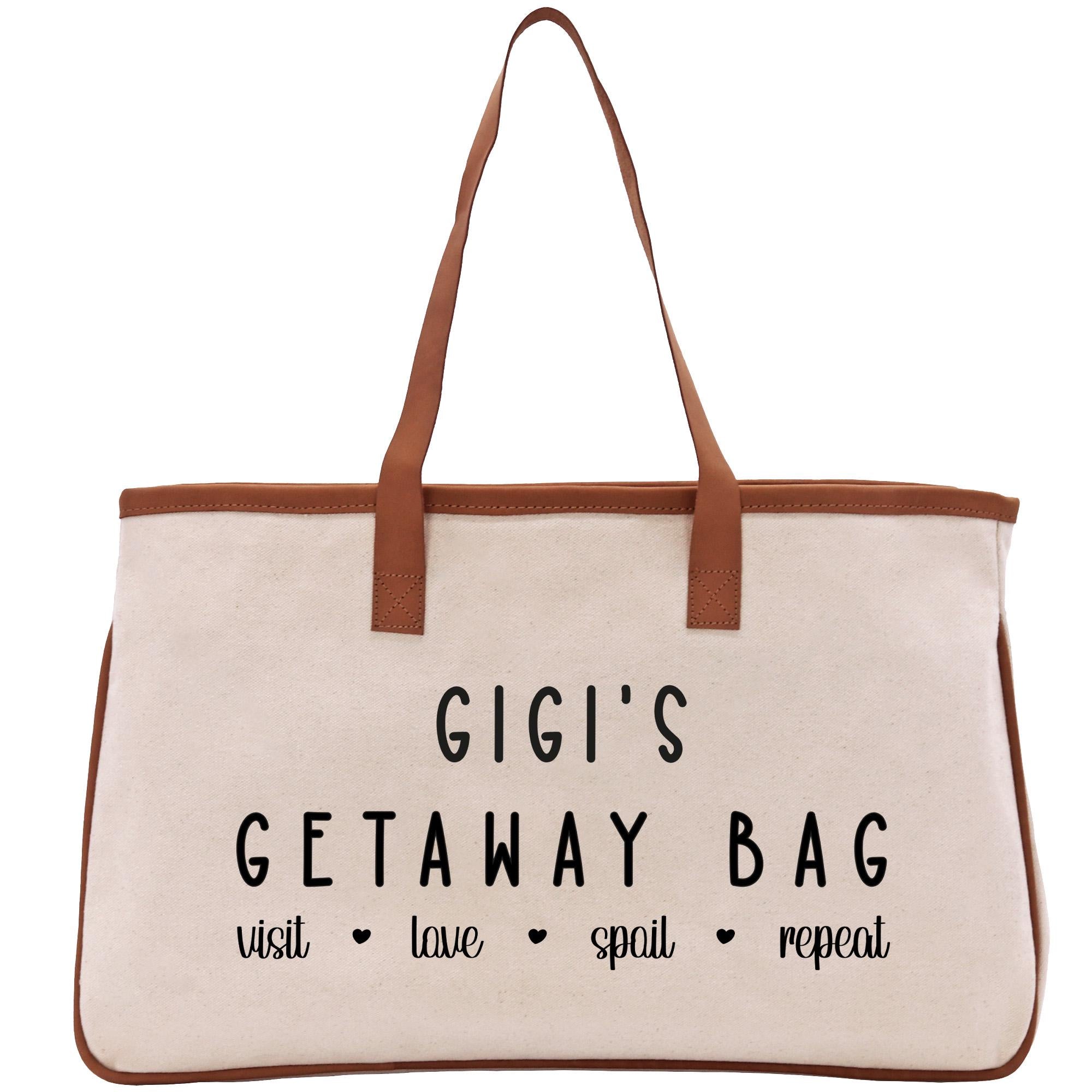 a canvas bag with a brown leather handle