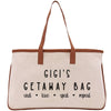 a canvas bag with a brown leather handle