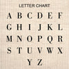 a black and white type of font on a linen background