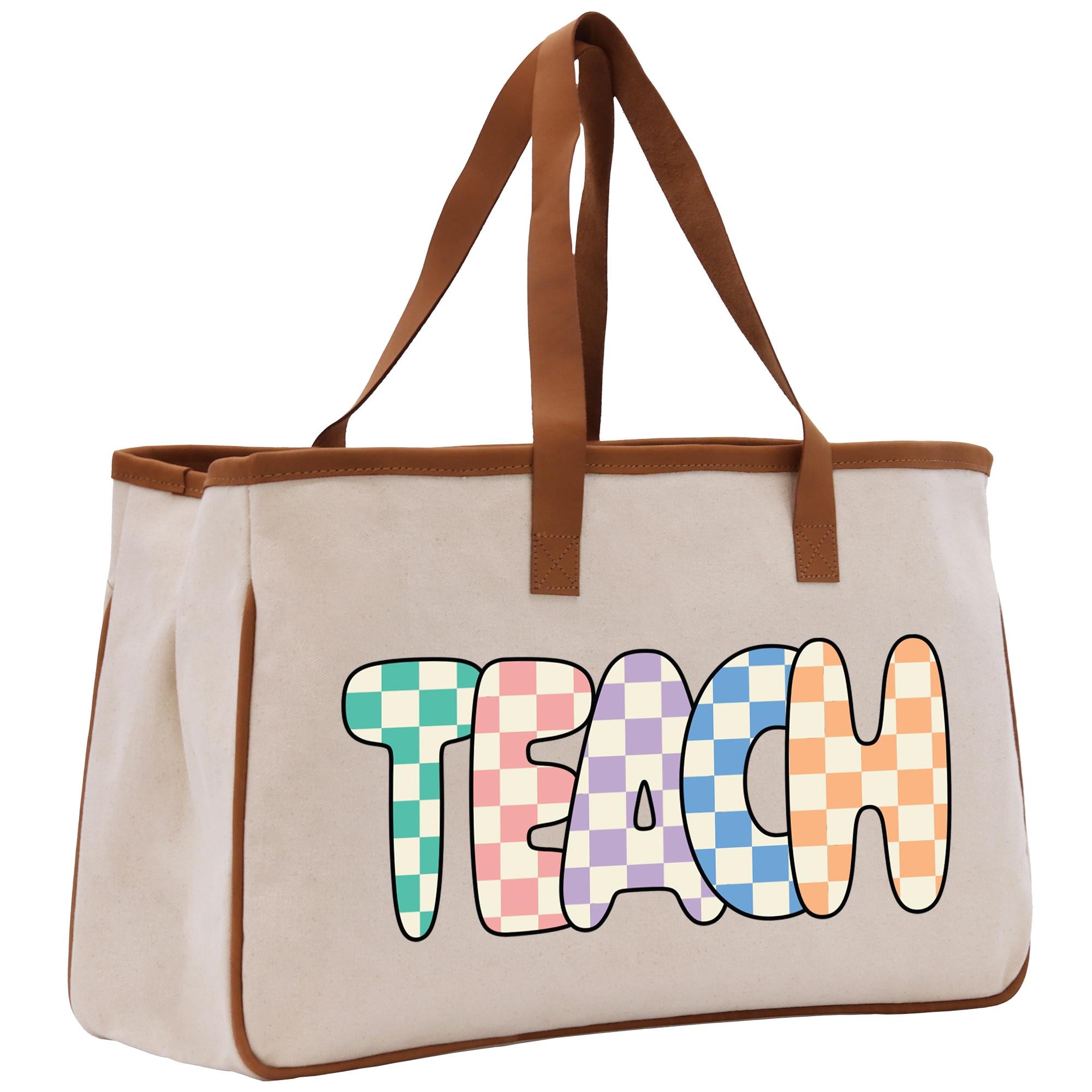 a canvas bag with the word teach painted on it