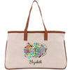 a white bag with a brown leather handle
