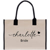 a white bag with a black handle that says charlotte bride