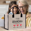 an older woman and a young girl holding a bag