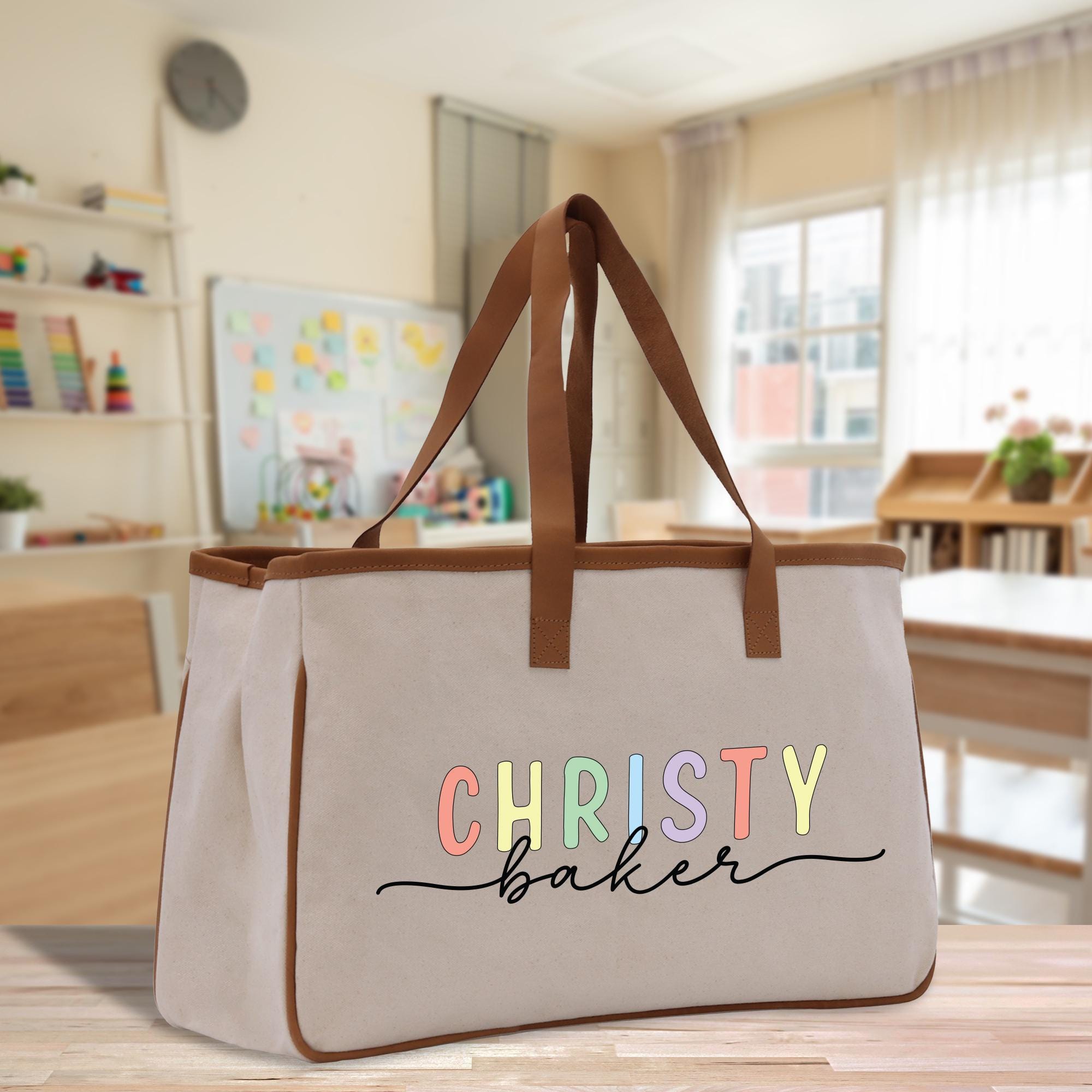 a canvas bag with the word christy baker on it